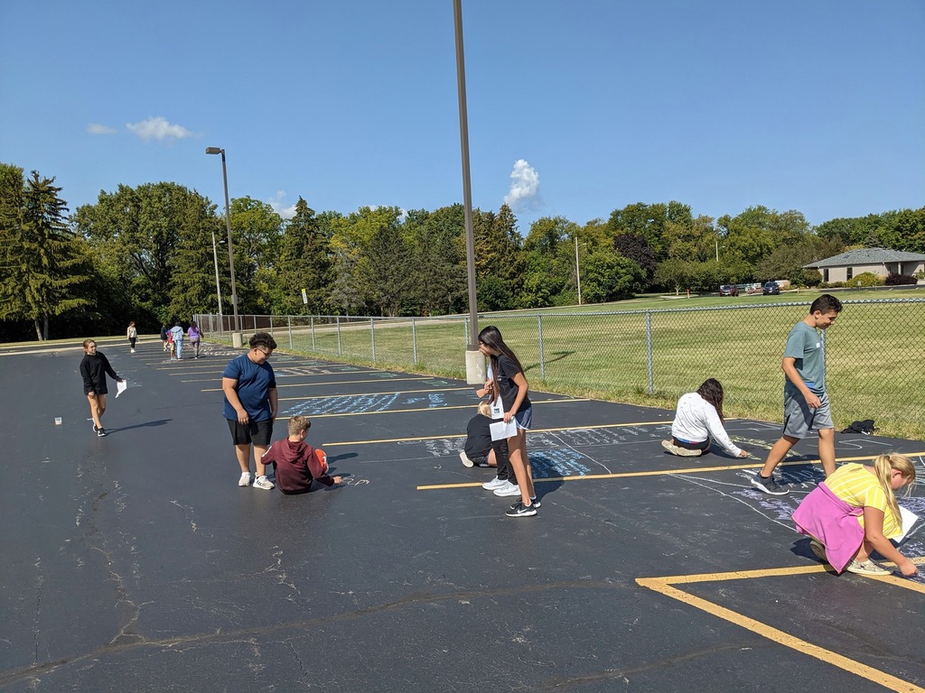 Students doing a chalk project
