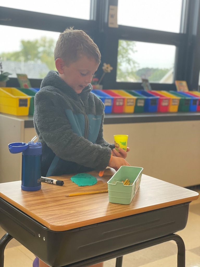 Boy playing with playdoh