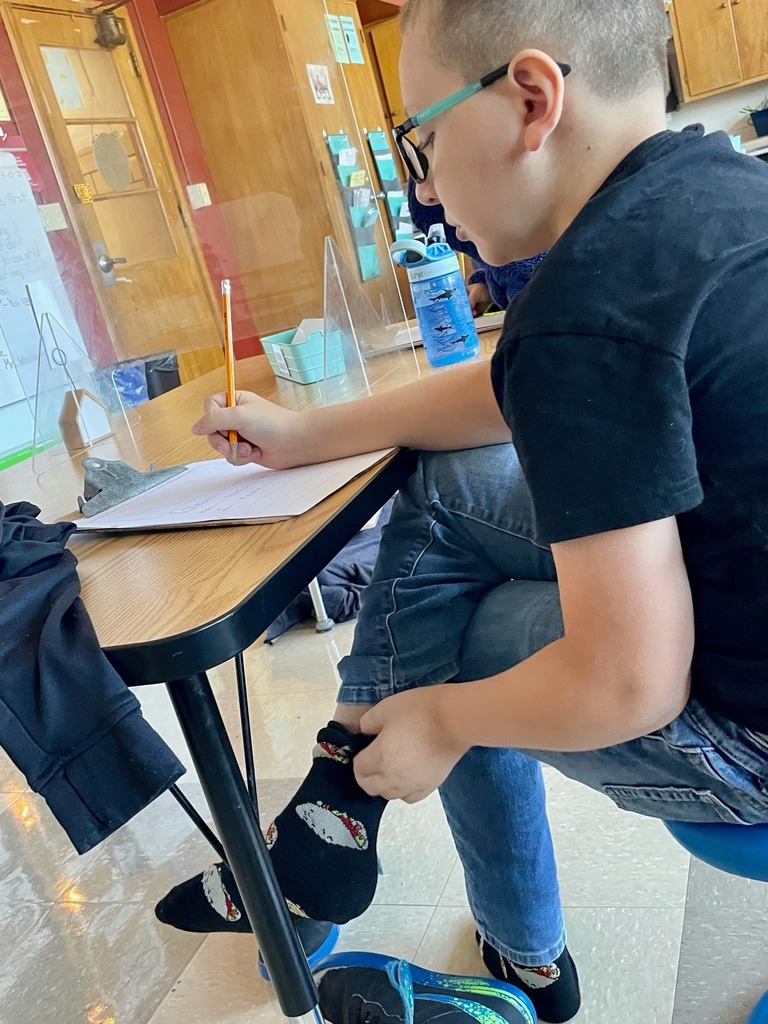 Boy writing at table