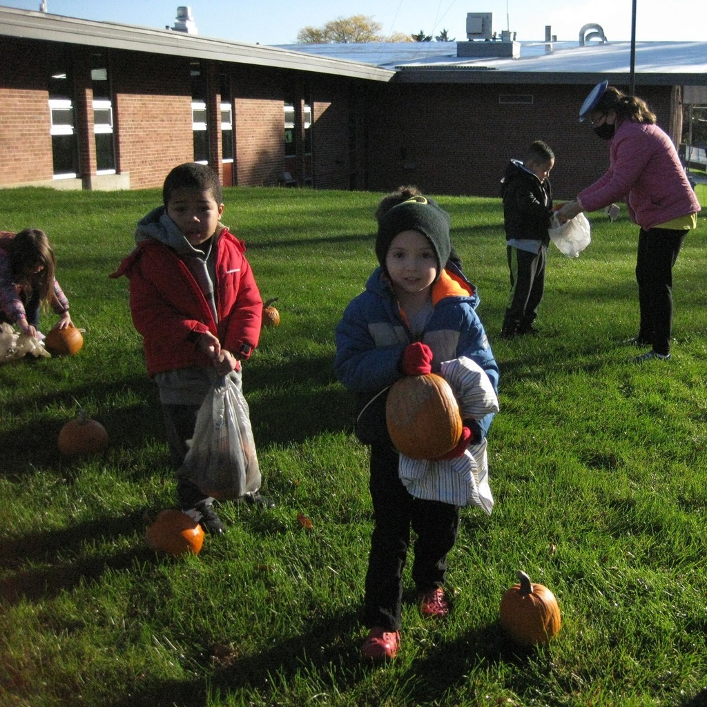 Children with pumpkins outside