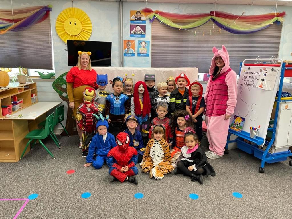 Teacher and students in costumes