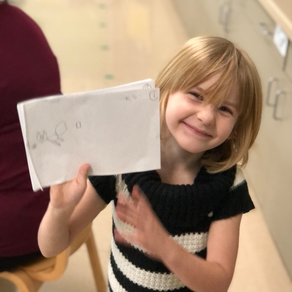 Child showing her drawing