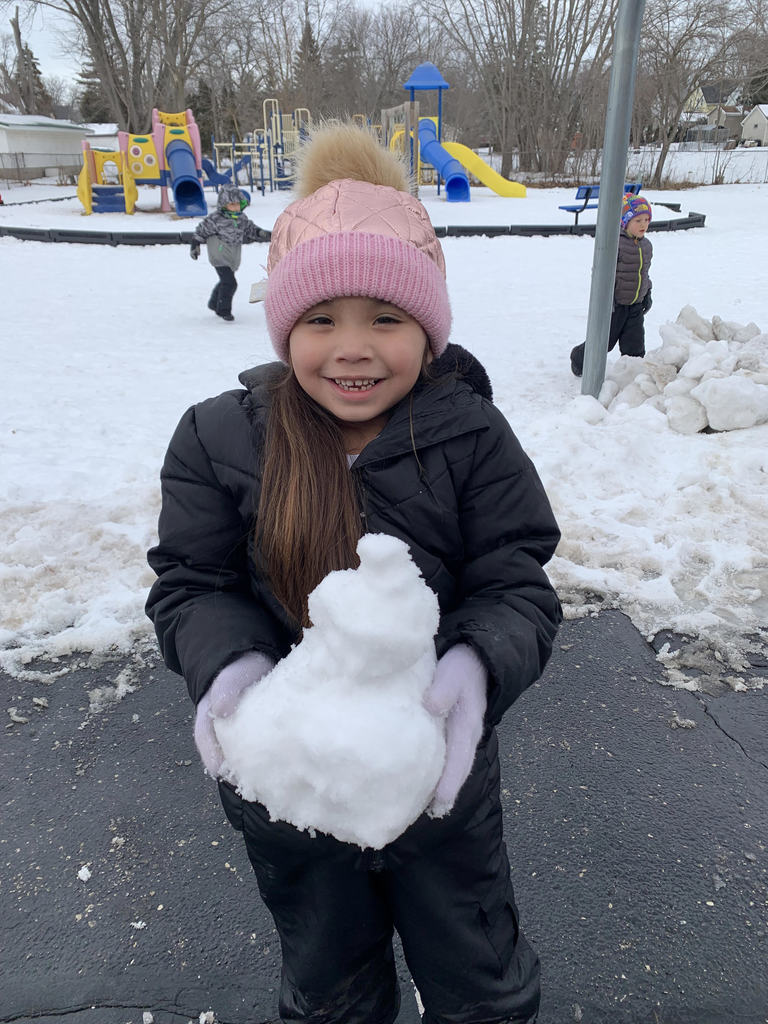 Girl with a block of snow