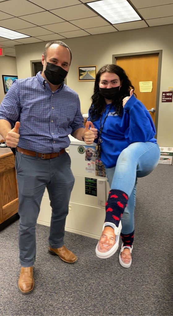 Principal and Student showing off her shoes