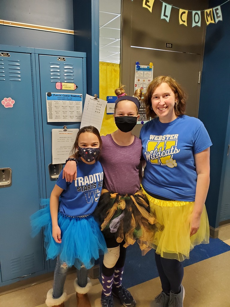 teacher and two students wearing tutus