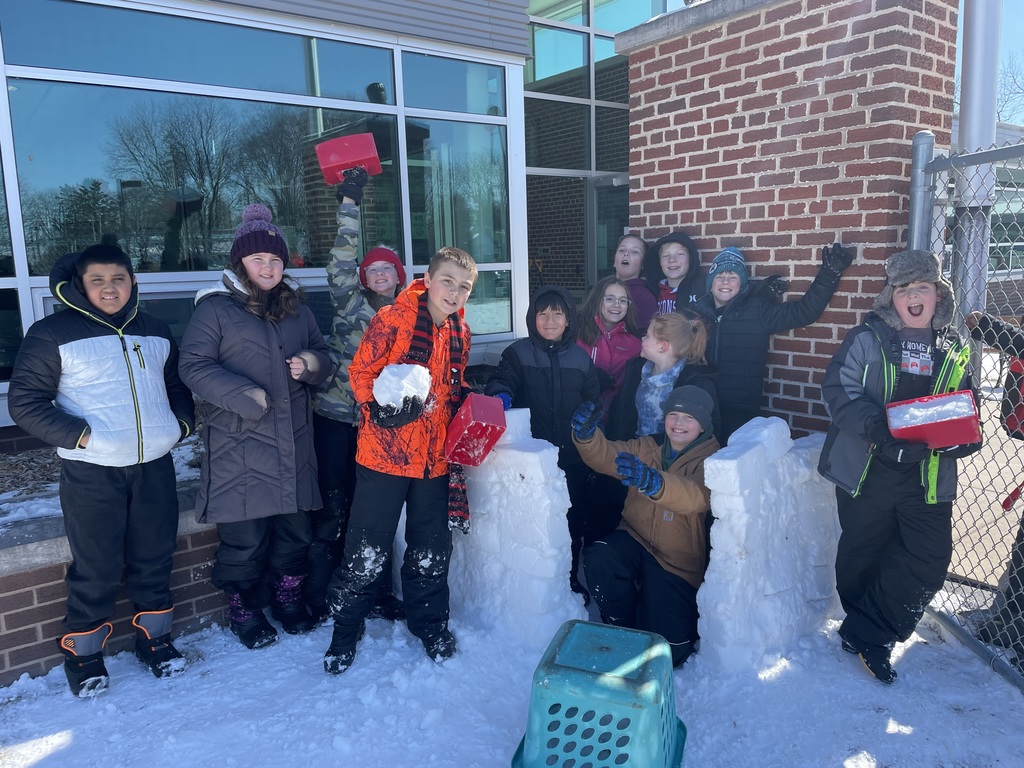 Students building a snow fort