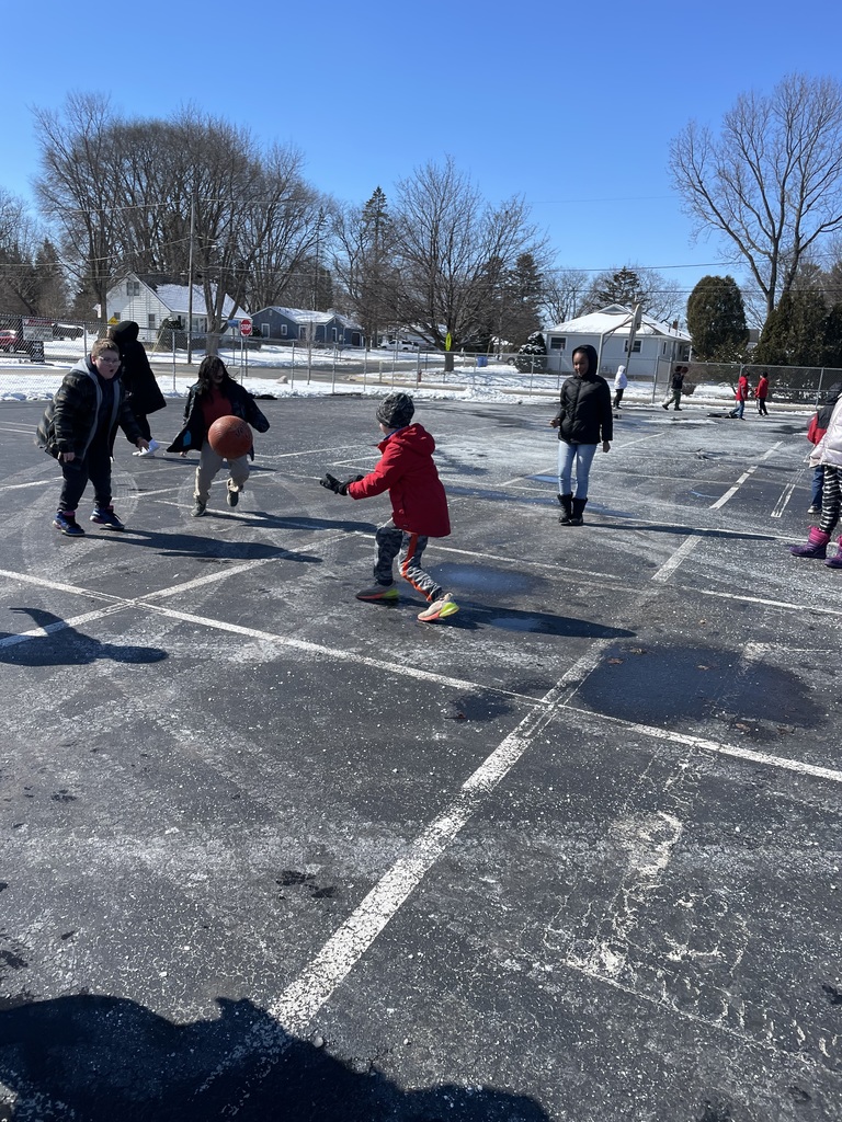 Students playing four square