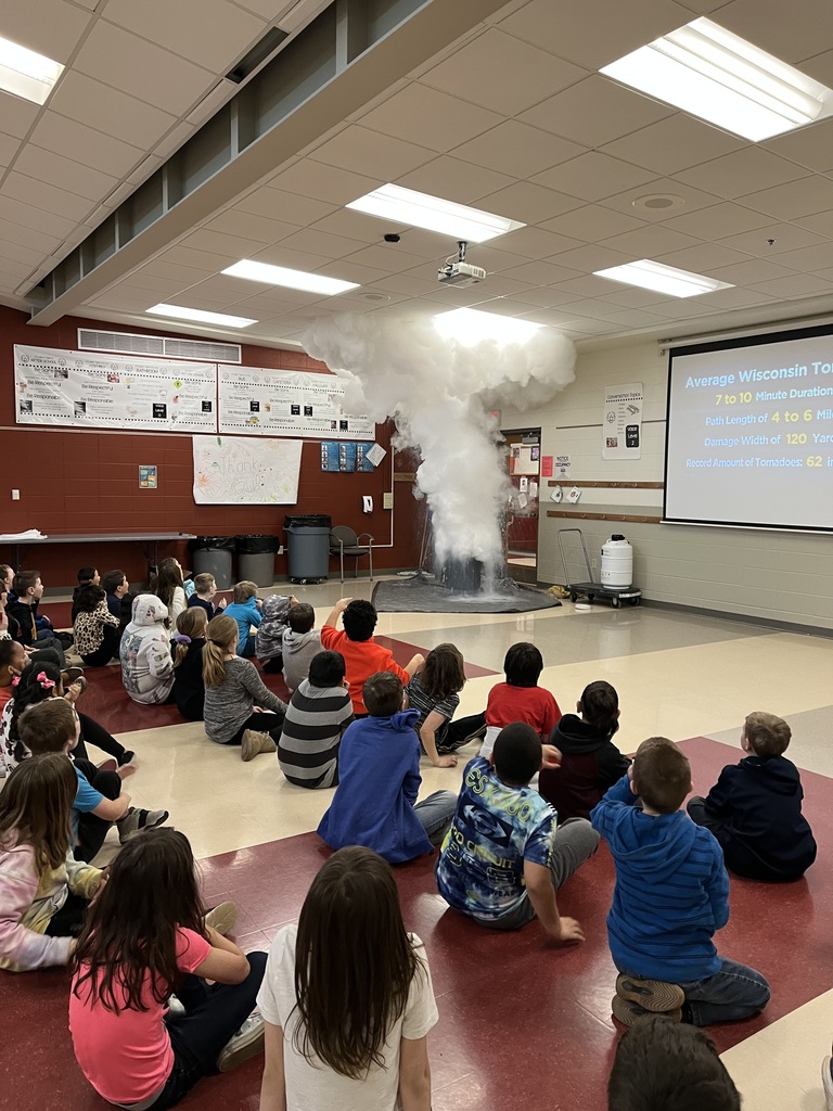 Meteorologist talking to a class with experiment