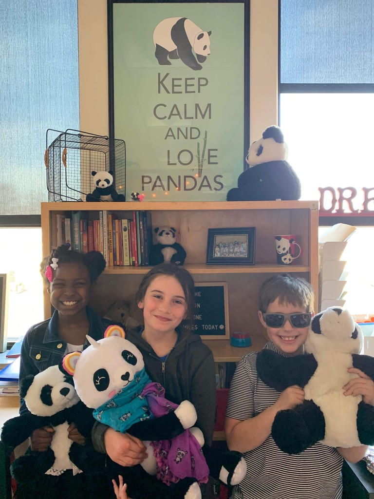 three students with stuffed panda bears