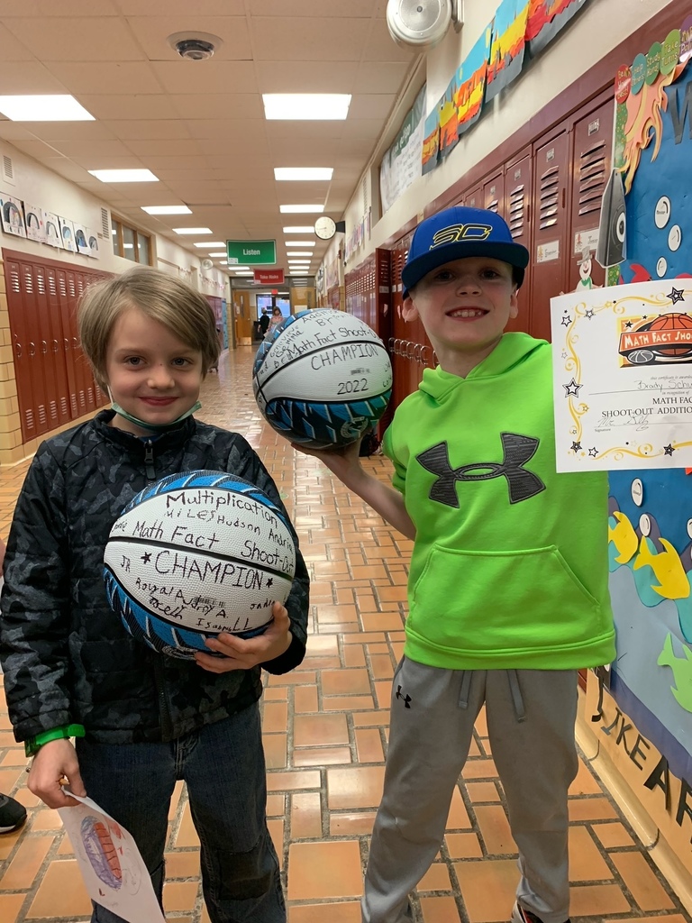 Two boys with signed basketballs
