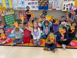 Students with handmade creepy carrots