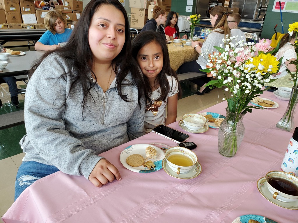Moms and children making flower bouquets