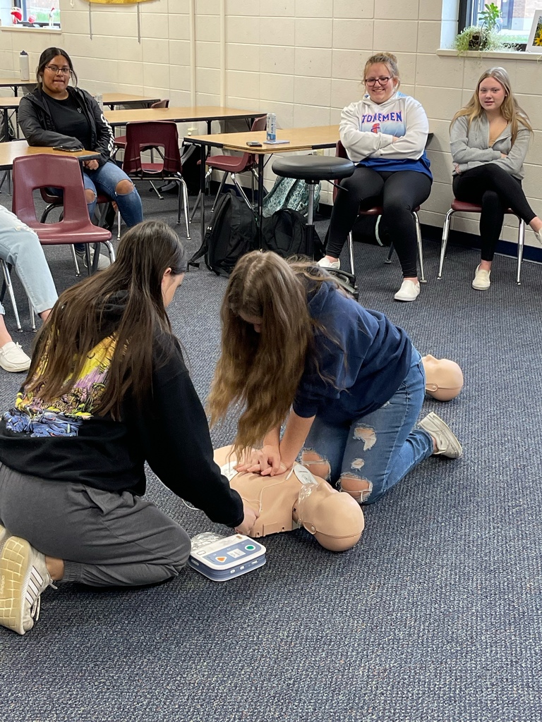 Students learning CPR