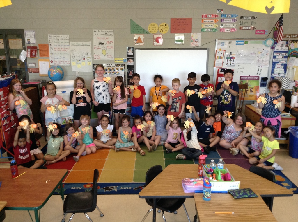 Kindergarten and third grade students with their homemade lion hands