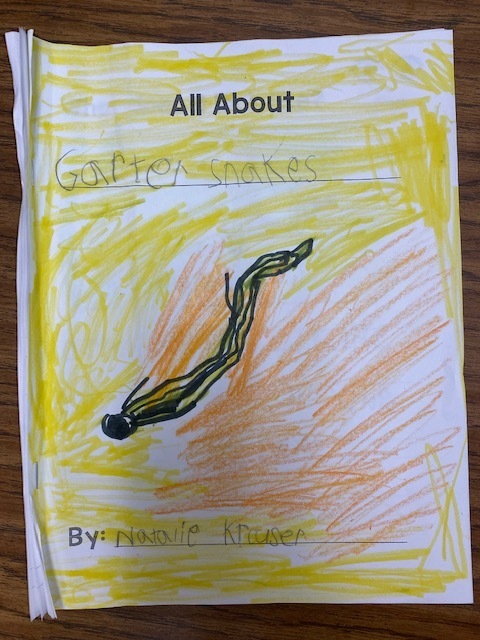 Kindergartener writing