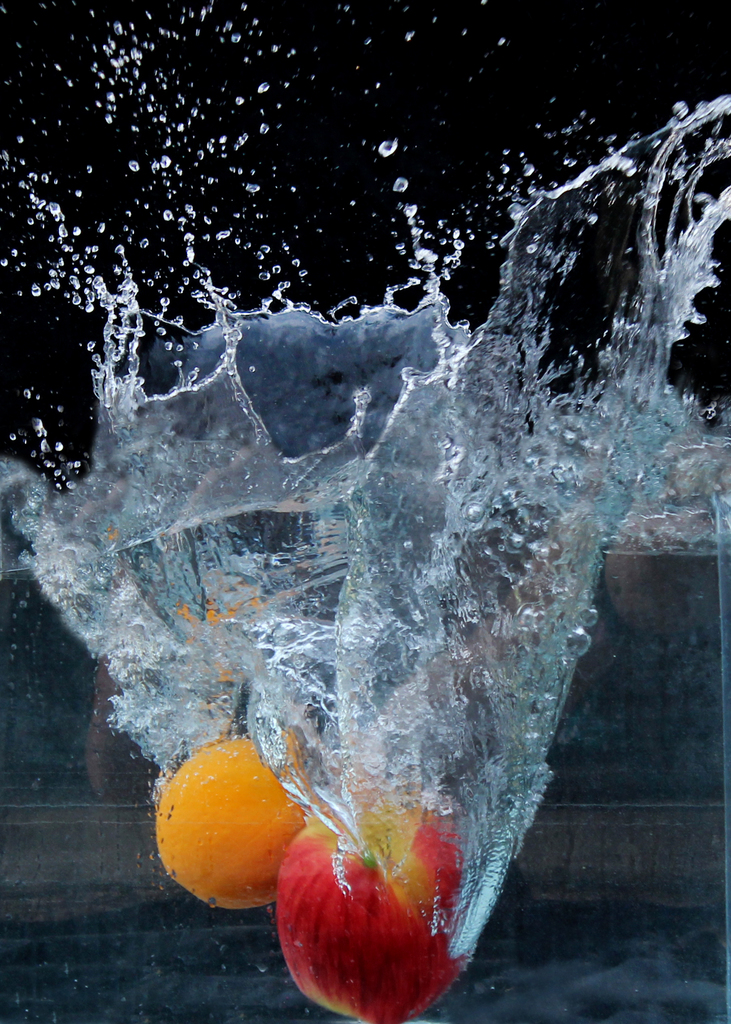 fruit dropped in water and splashing