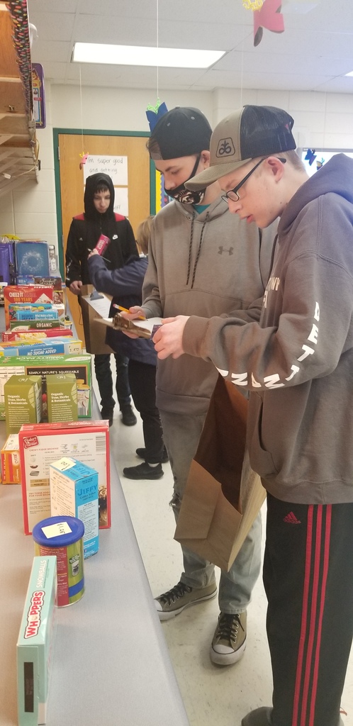 students reading boxes for measurements