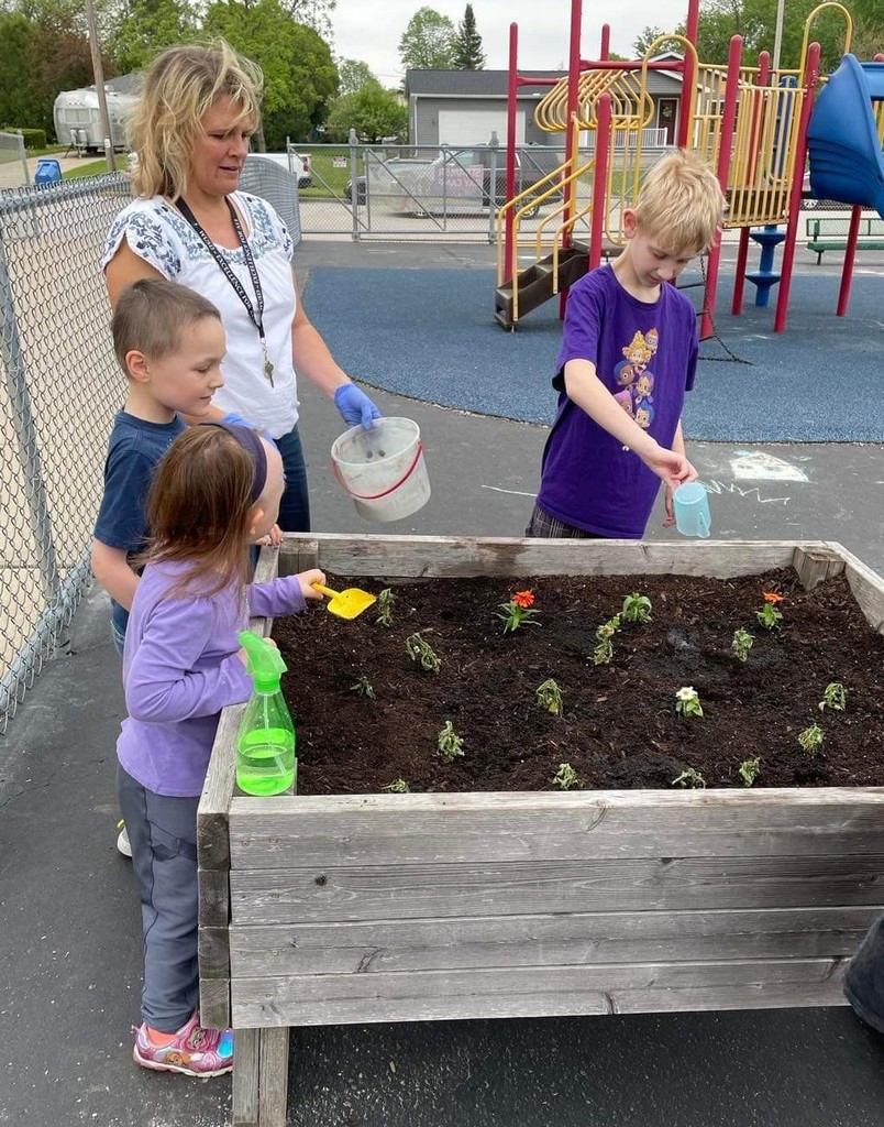 Students planting flowers 