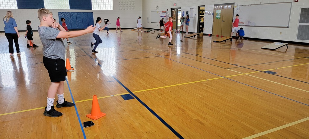 Students playing corn hole