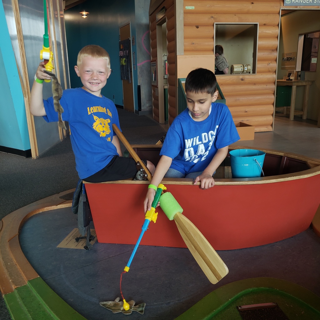Two boys fishing at the museum