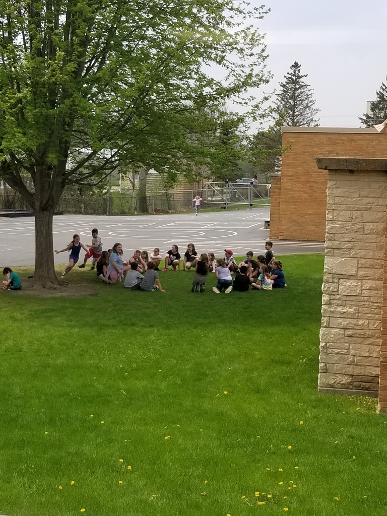 Students playing duck, duck, goose