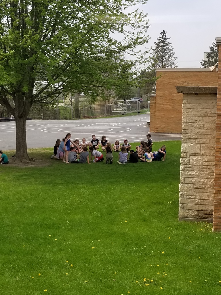 Students playing duck, duck, goose