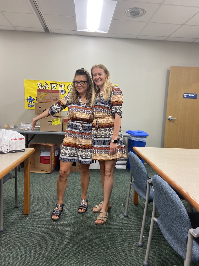 Two teachers wearing matching outfits