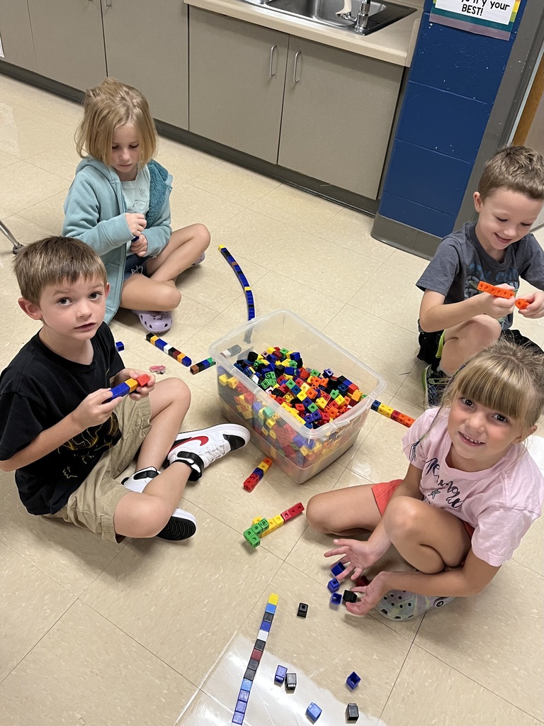 students doing math with blocks