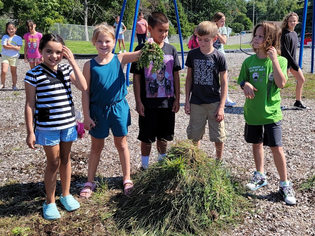 Students with their weed monster on the playground