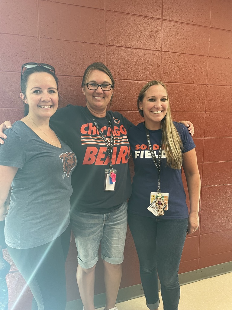three staff wearing Bears shirts