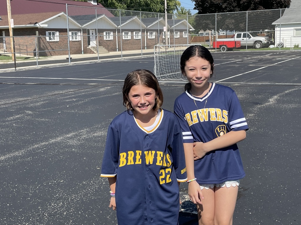 two students wearing Brewer shirts
