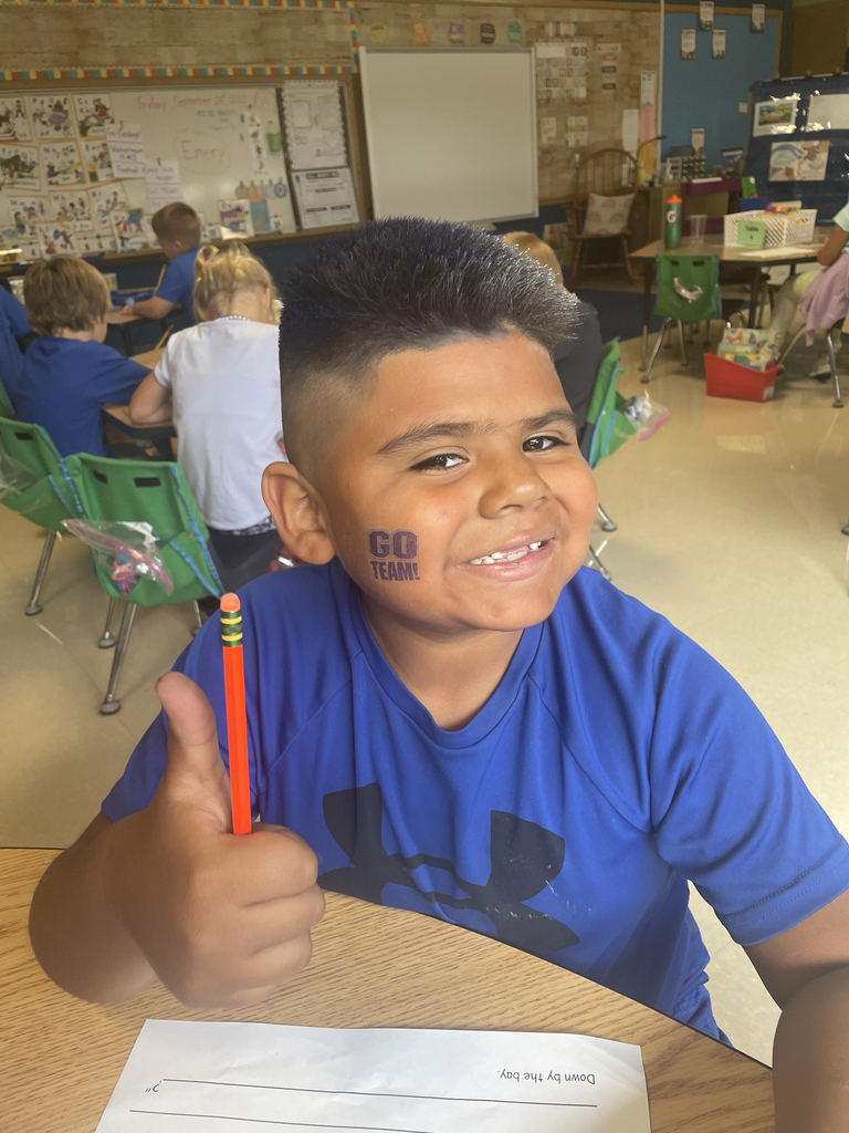 boy with thumbs up