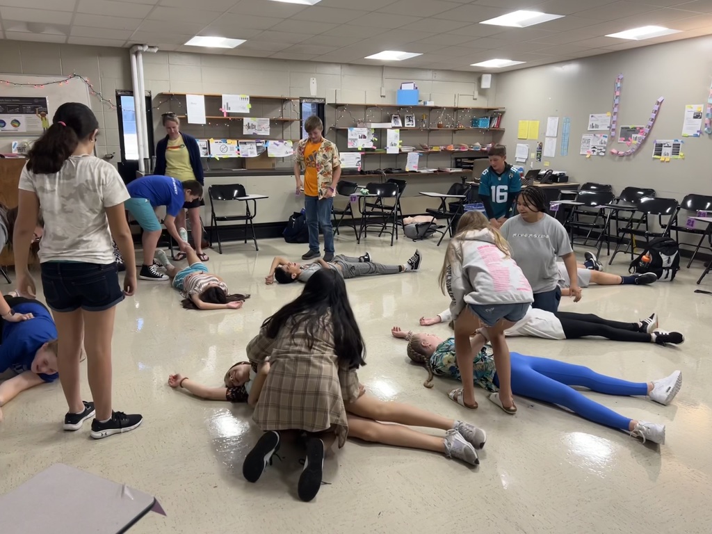 Students learning first aid skills