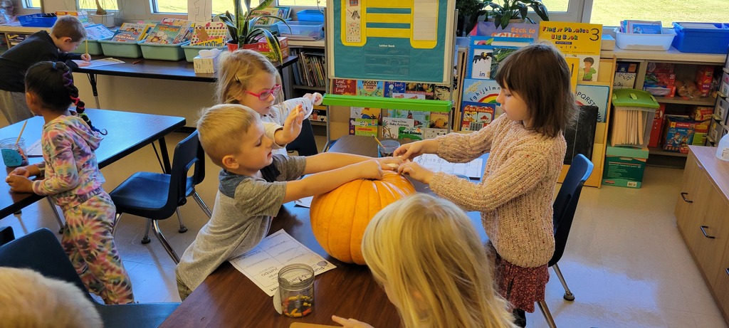 Students with a pumpkin