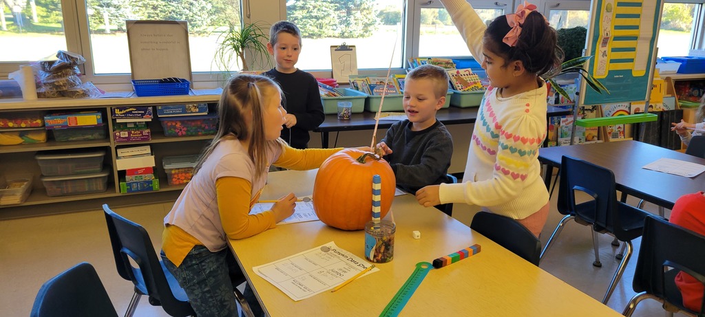 Students with a pumpkin