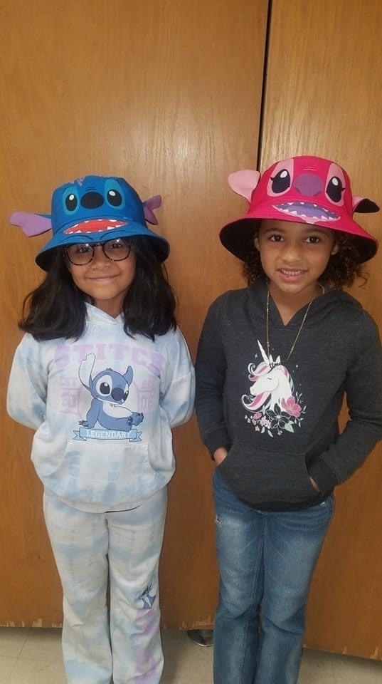 Two students with hats