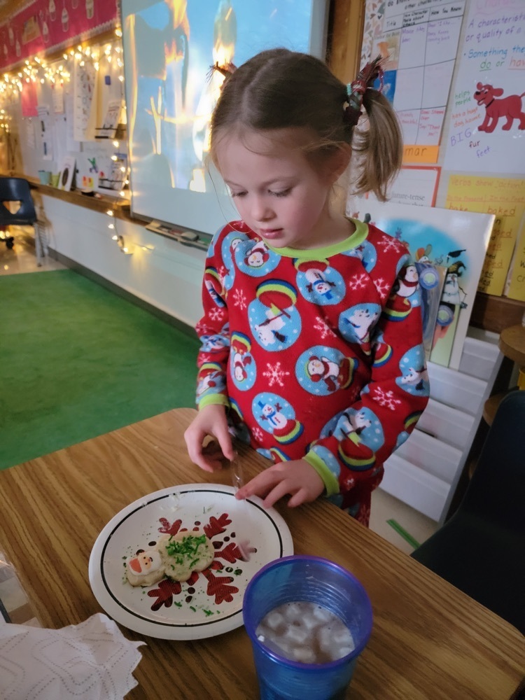 girl decorating a cookie