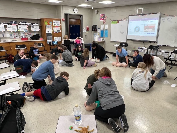 students practicing cpr